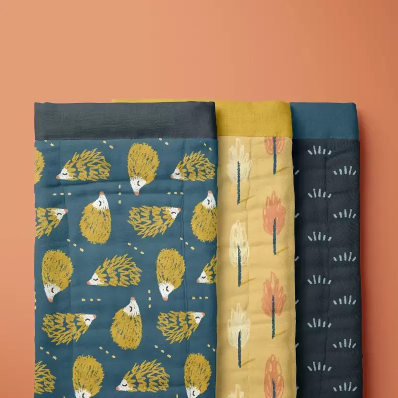 Burp cloth with hedgehog, trees and grass pattern
