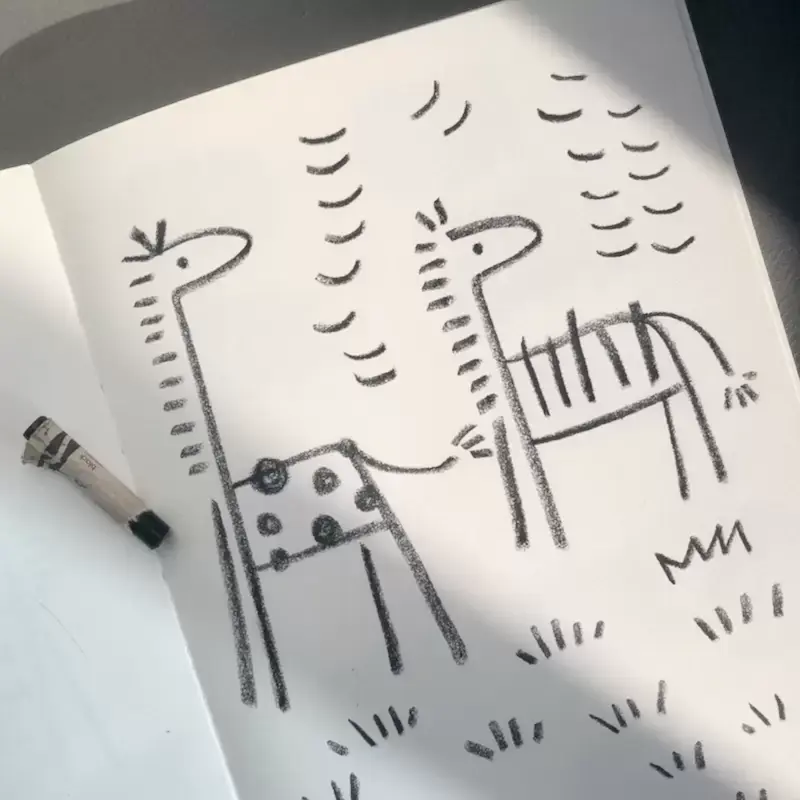 Crayon drawing of giraffe and zebra